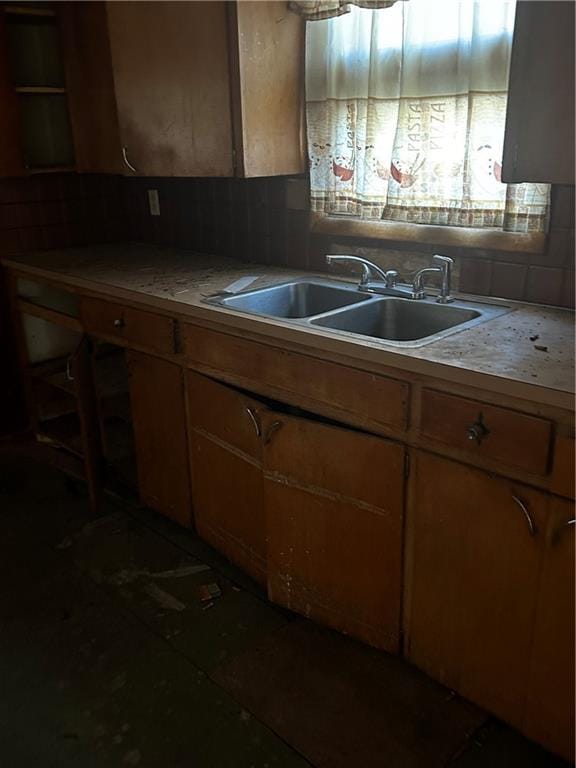 kitchen featuring sink and backsplash