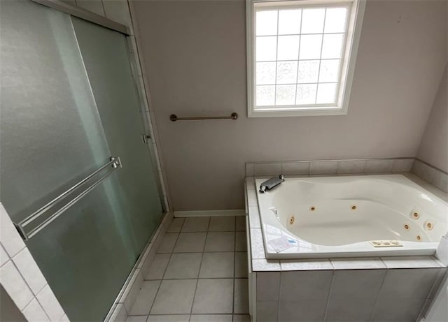 bathroom featuring tile patterned flooring and shower with separate bathtub