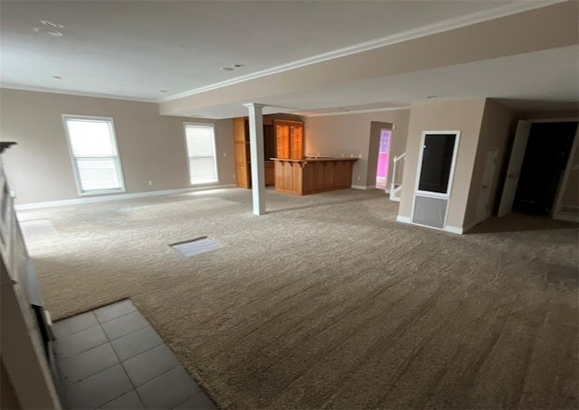 interior space featuring carpet flooring and crown molding