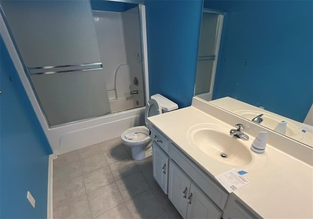 full bathroom featuring tile patterned floors, vanity, toilet, and enclosed tub / shower combo