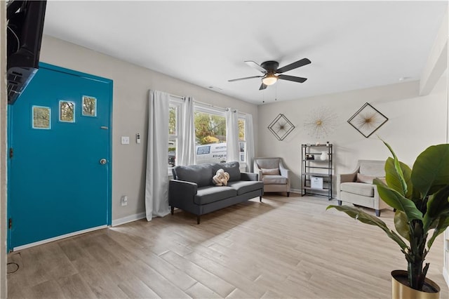 unfurnished living room featuring light hardwood / wood-style floors and ceiling fan