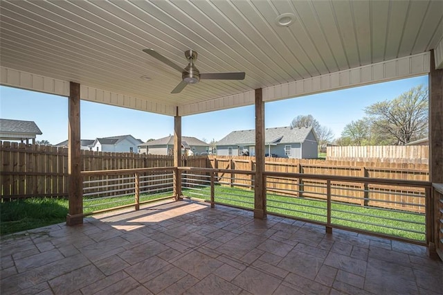 view of patio / terrace featuring a residential view, a fenced backyard, and ceiling fan