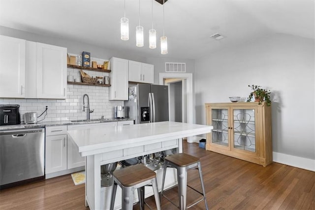 kitchen featuring sink, white cabinets, stainless steel appliances, and dark hardwood / wood-style floors