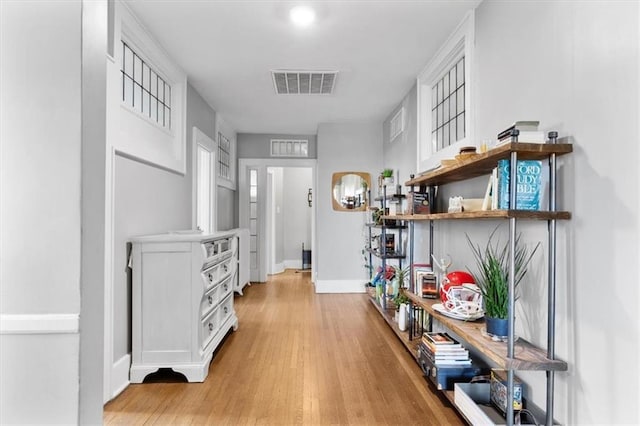 hallway featuring light hardwood / wood-style flooring