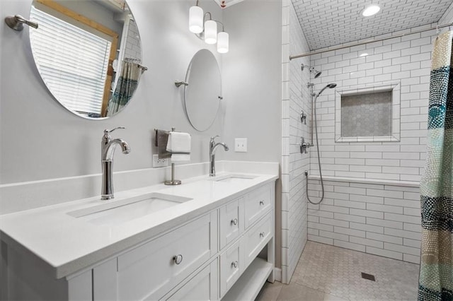 bathroom with a shower with curtain, tile patterned flooring, and vanity