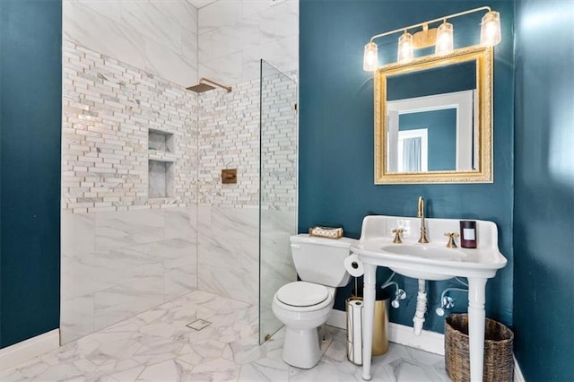 full bath with toilet, marble finish floor, baseboards, and a walk in shower