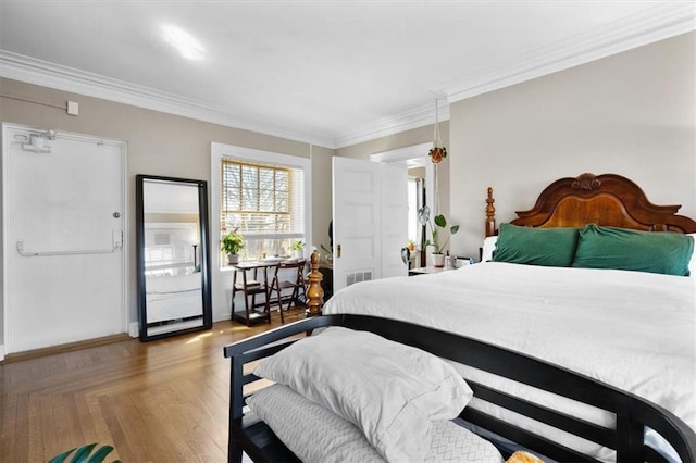 bedroom with visible vents and ornamental molding