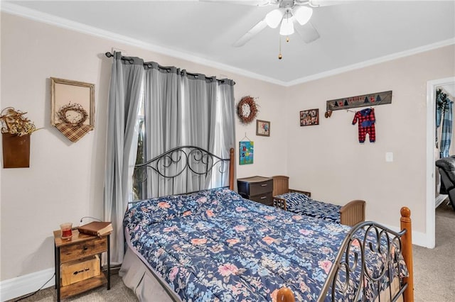 carpeted bedroom with ornamental molding and ceiling fan