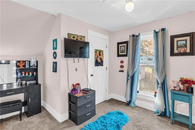 bedroom with vaulted ceiling and carpet floors