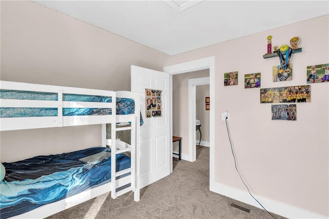 bedroom featuring light carpet