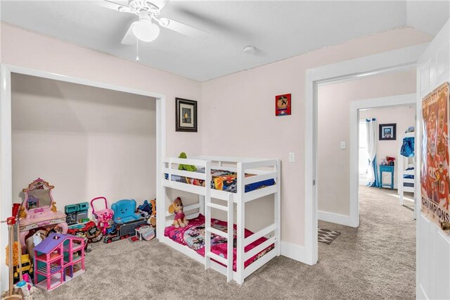 bedroom featuring light carpet and ceiling fan