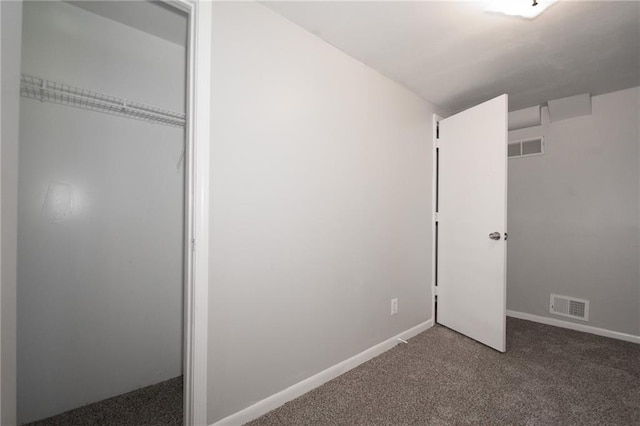 unfurnished bedroom with a closet and carpet