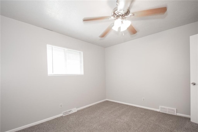 spare room with carpet flooring and ceiling fan