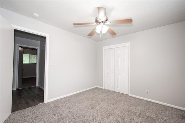 unfurnished bedroom featuring a closet, carpet, and ceiling fan