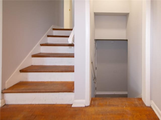 stairway featuring hardwood / wood-style flooring