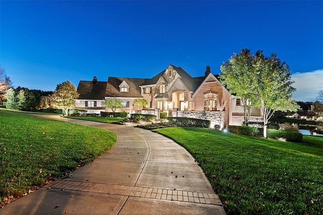 view of front of home with a front lawn