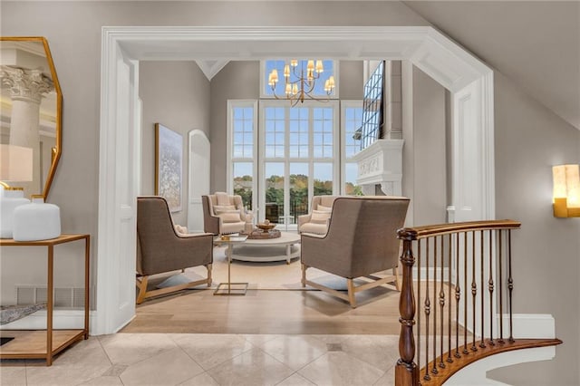 sitting room with a chandelier and light hardwood / wood-style flooring