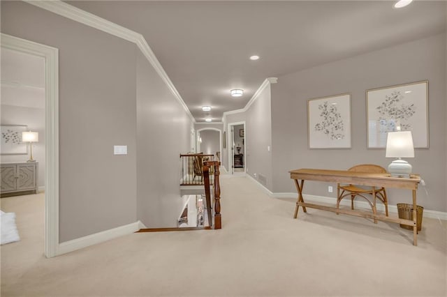 hall featuring carpet floors and crown molding