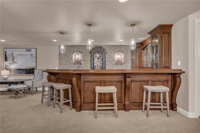 bar with light carpet and pendant lighting