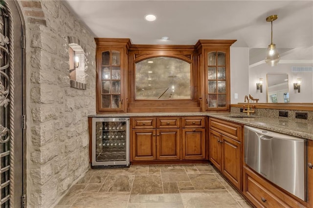 bar featuring light stone counters, dishwasher, sink, decorative light fixtures, and wine cooler