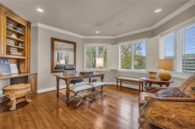 office space with wood-type flooring and ornamental molding