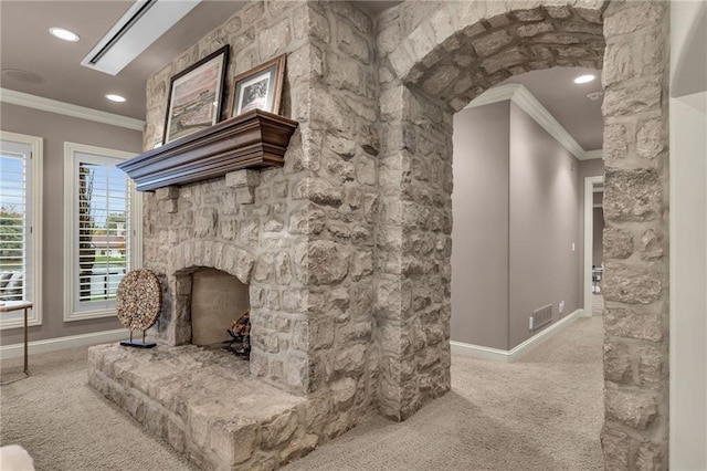 living room featuring a stone fireplace, light carpet, and ornamental molding