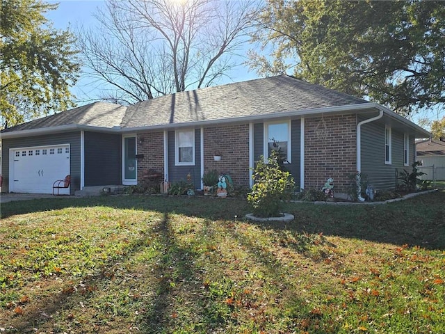 ranch-style home with a garage and a front lawn