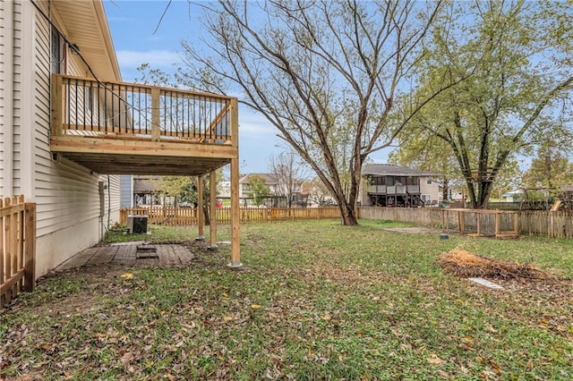 view of yard featuring central AC unit and a deck