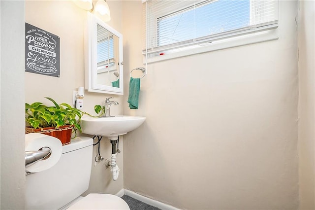 bathroom with toilet and sink