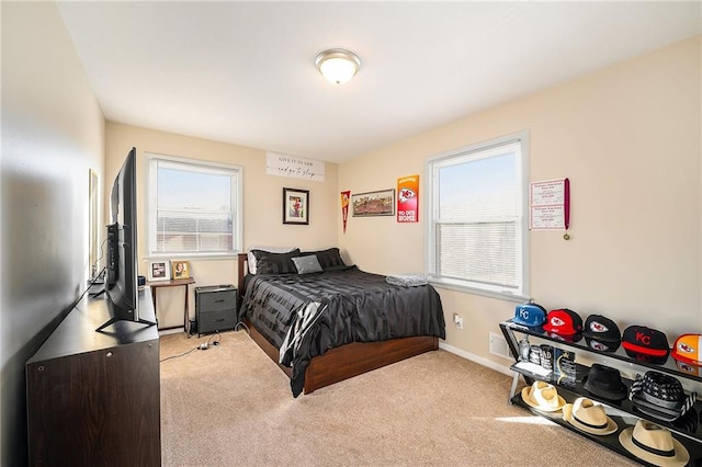 bedroom featuring light colored carpet