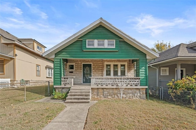 bungalow featuring a front yard and a porch