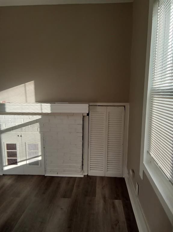 interior space with dark hardwood / wood-style floors