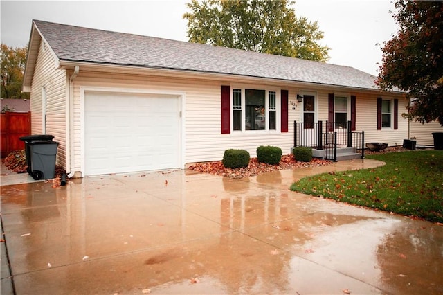 single story home with a front lawn and a garage