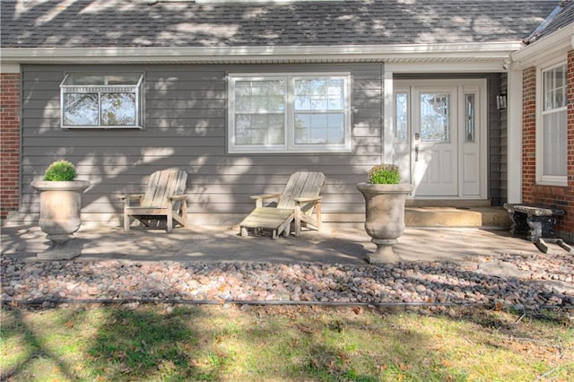 entrance to property with a patio