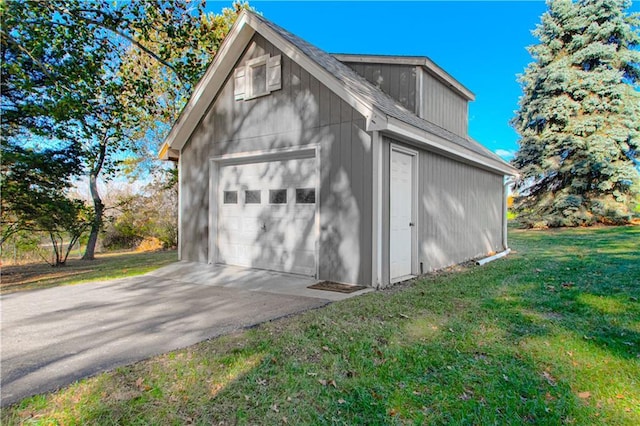 garage featuring a lawn