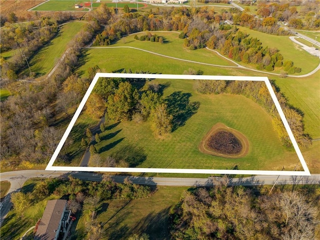 birds eye view of property with a rural view