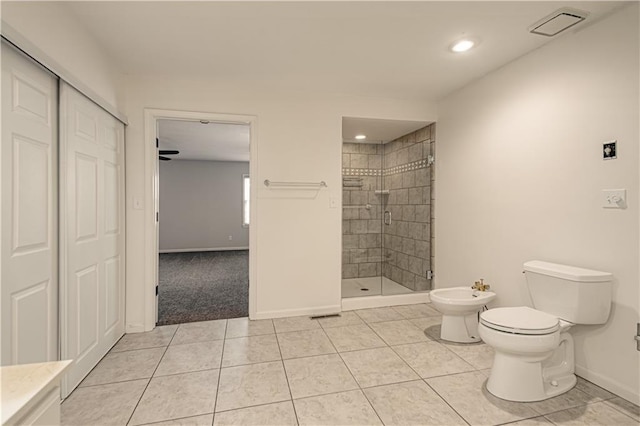 bathroom with toilet, a shower with door, a bidet, and tile patterned flooring