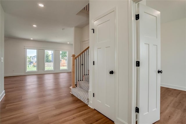 stairs with hardwood / wood-style flooring