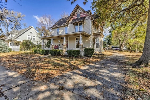 victorian house featuring covered porch