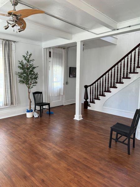 foyer entrance featuring dark wood-type flooring, beamed ceiling, crown molding, and ceiling fan