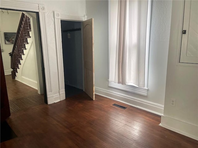 interior space with dark hardwood / wood-style flooring