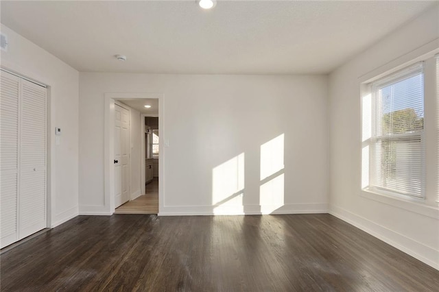 spare room featuring dark hardwood / wood-style flooring