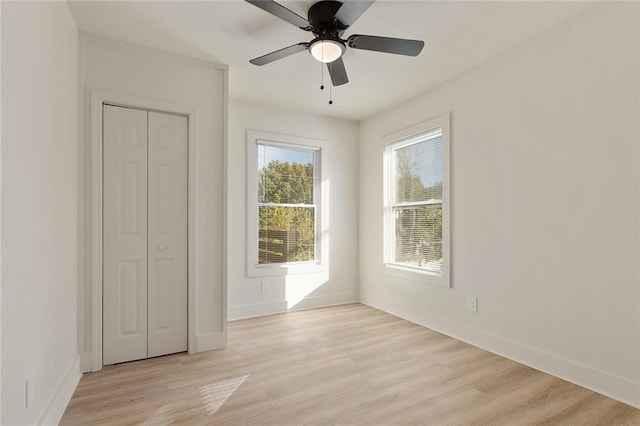 unfurnished bedroom featuring a closet, ceiling fan, and light hardwood / wood-style floors