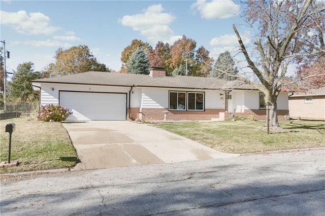 ranch-style house featuring a garage and a front yard