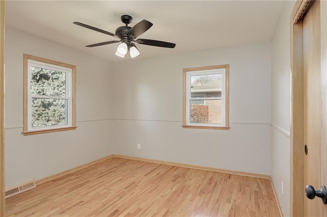 empty room featuring light hardwood / wood-style flooring and ceiling fan