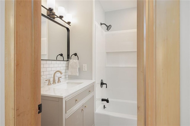 bathroom with vanity, tasteful backsplash, and bathtub / shower combination