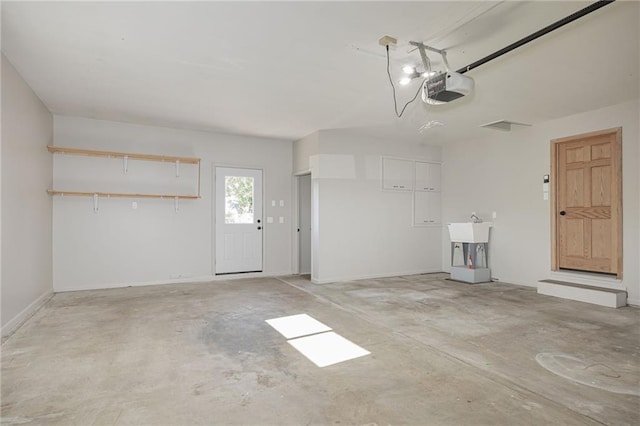 garage featuring a garage door opener and sink