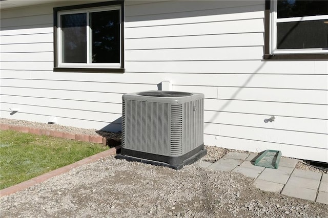 exterior details featuring wooden walls and cooling unit