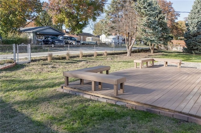 view of community with a lawn and a wooden deck