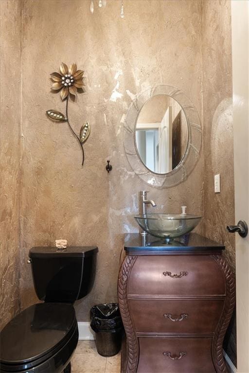 bathroom with vanity, tile patterned floors, and toilet